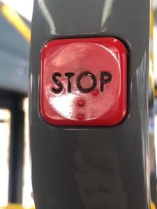 ‘Stop’ button on a bus with braille