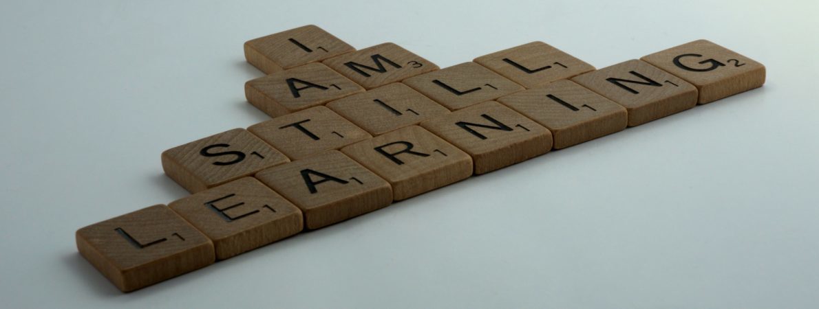 I am still learning text made by Scrabble tiles